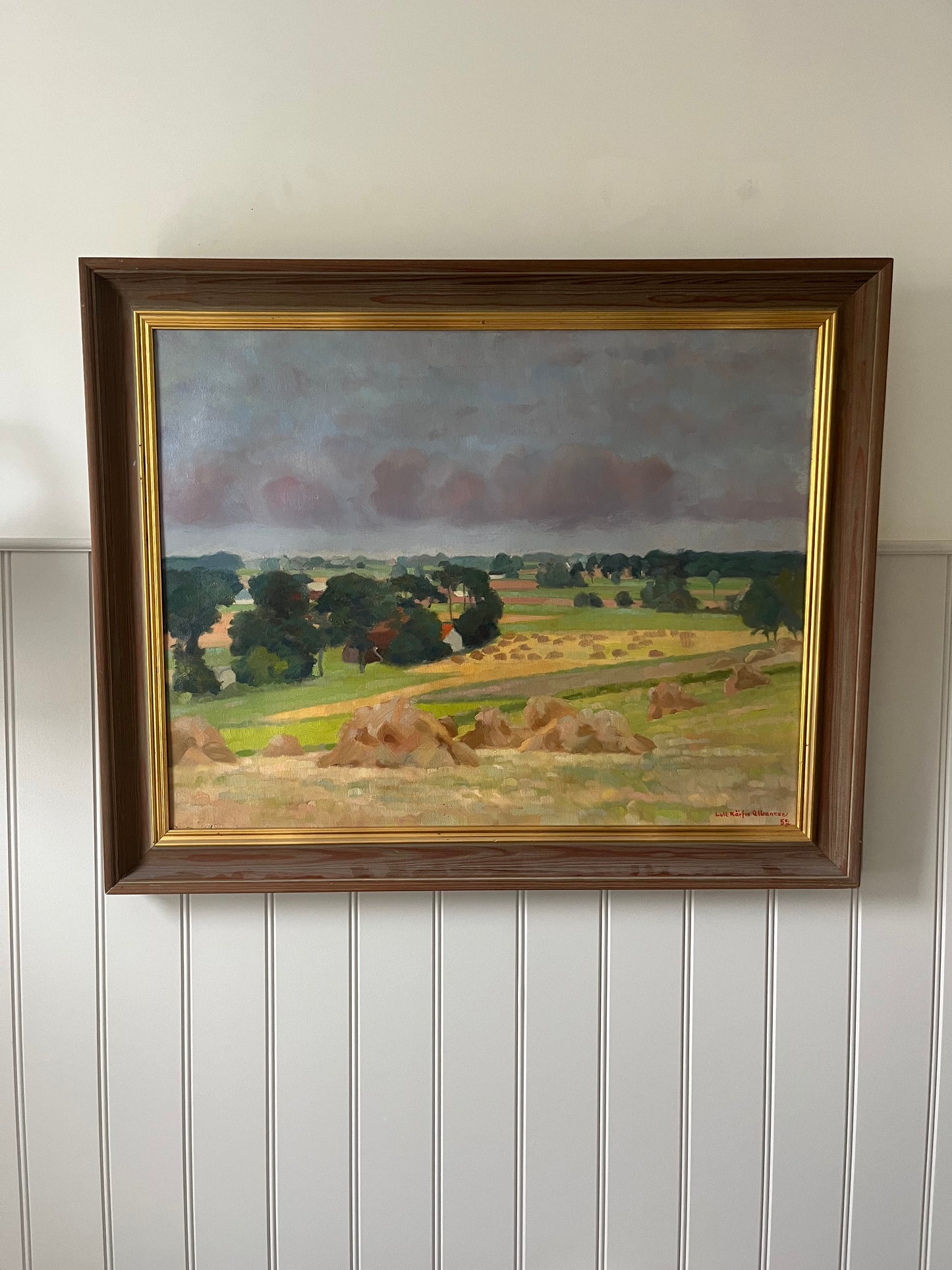 Hay bales and green trees