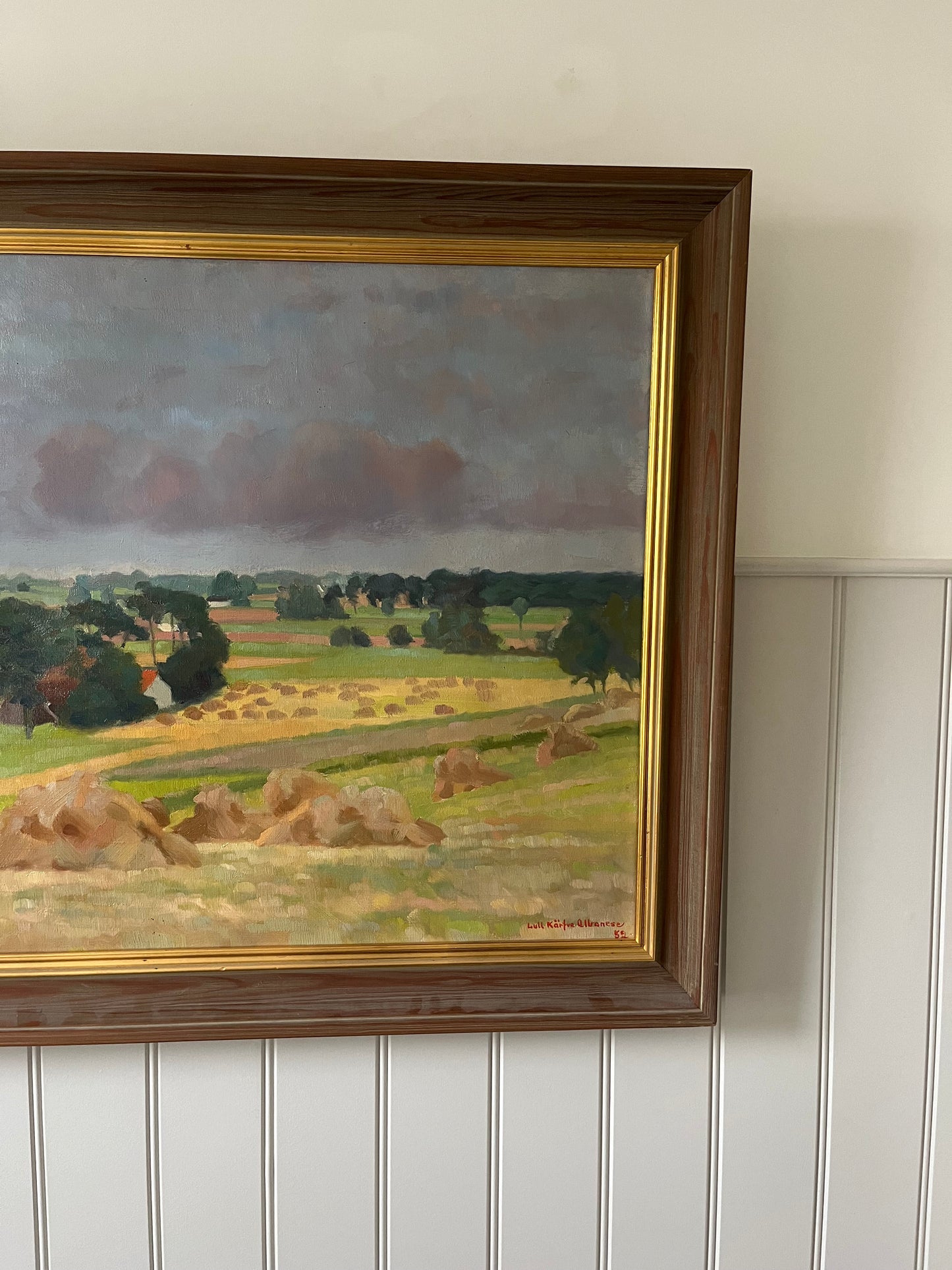 Hay bales and green trees