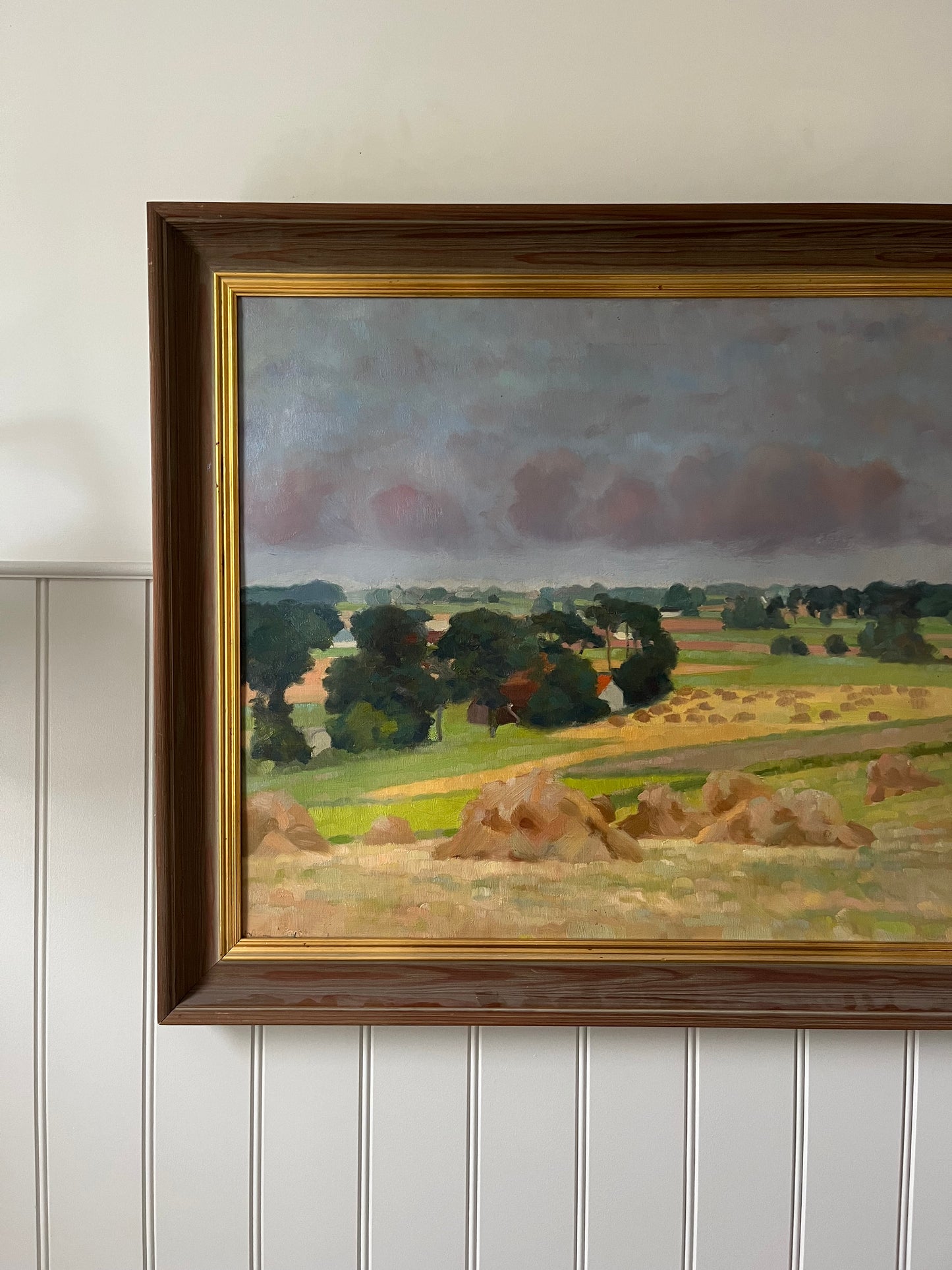 Hay bales and green trees