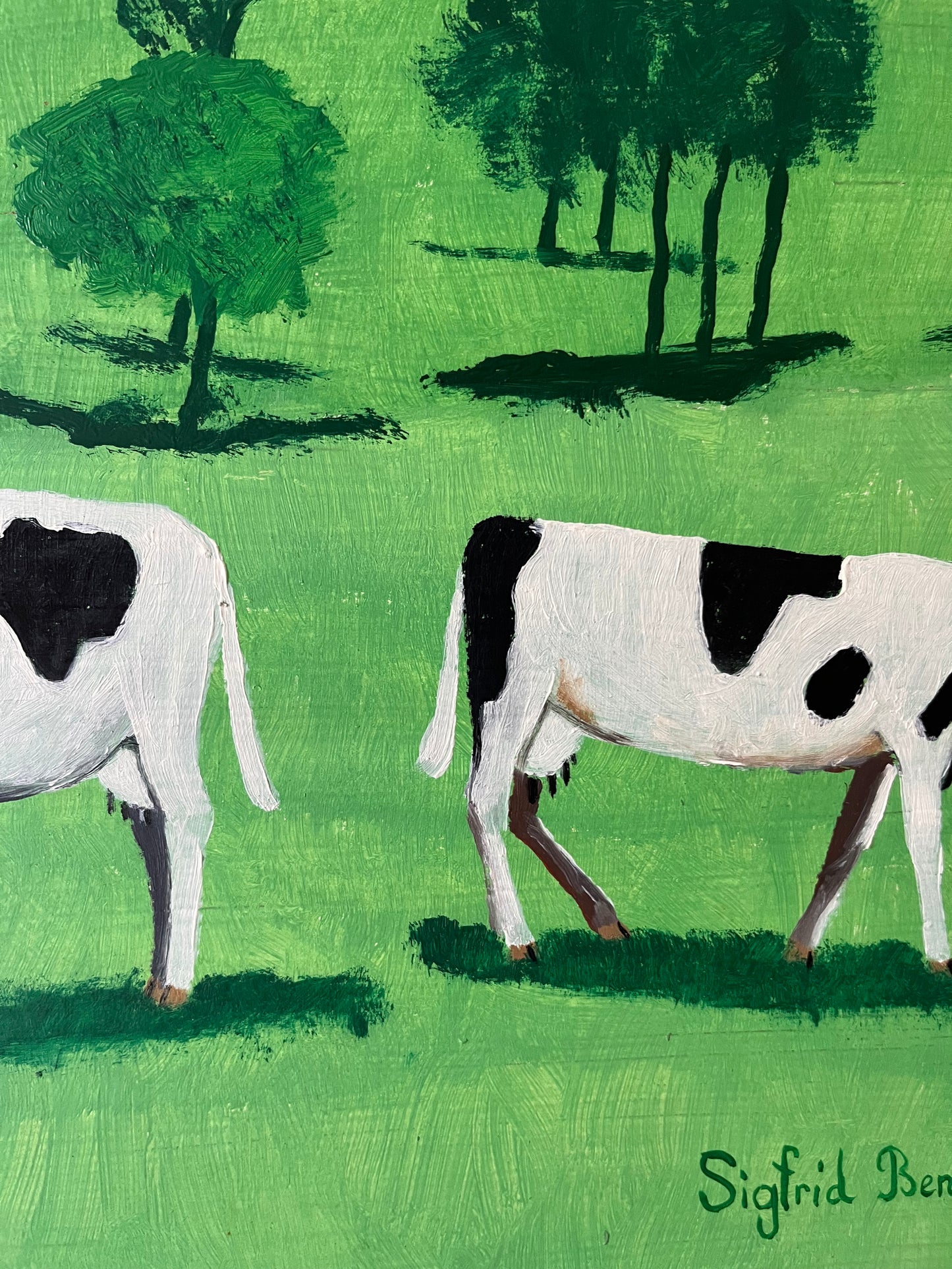 Cows in green field