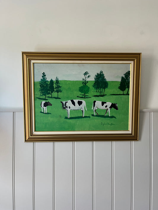 Cows in green field