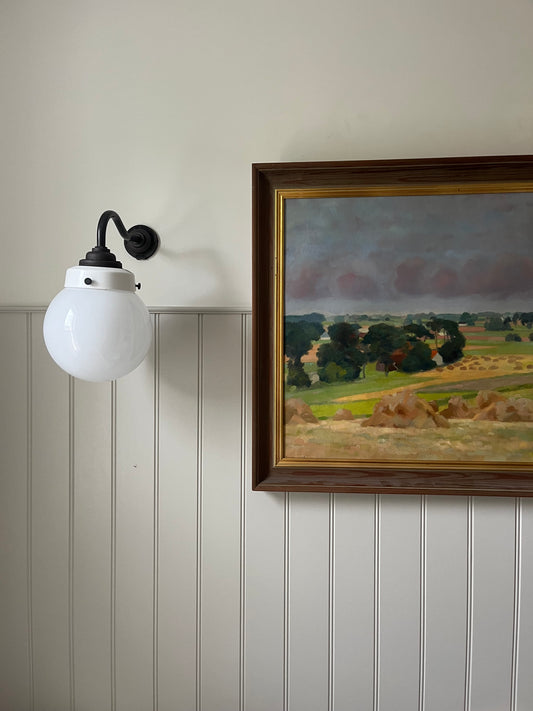 Hay bales and green trees